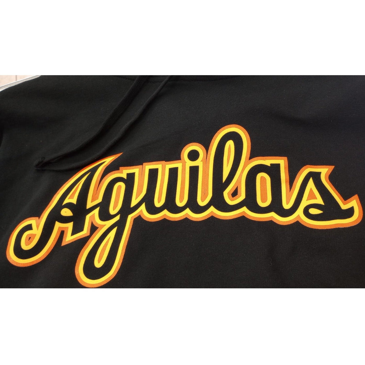 Aguilas Cibaeñas Cursive letters and Black Hooded