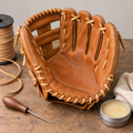 Leather slow-pitch glove with inner palm patch repair